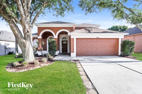 A house with a brown garage door is for sale.