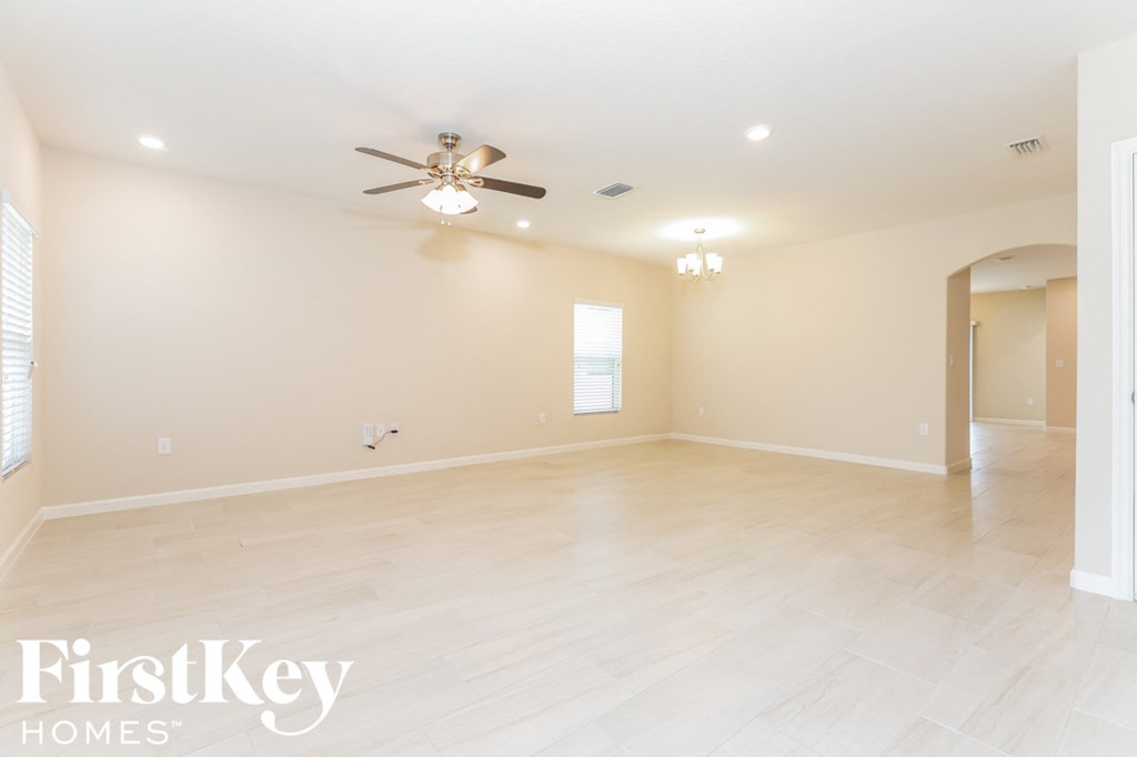 the spacious living room and dining room are open to the kitchen and family room