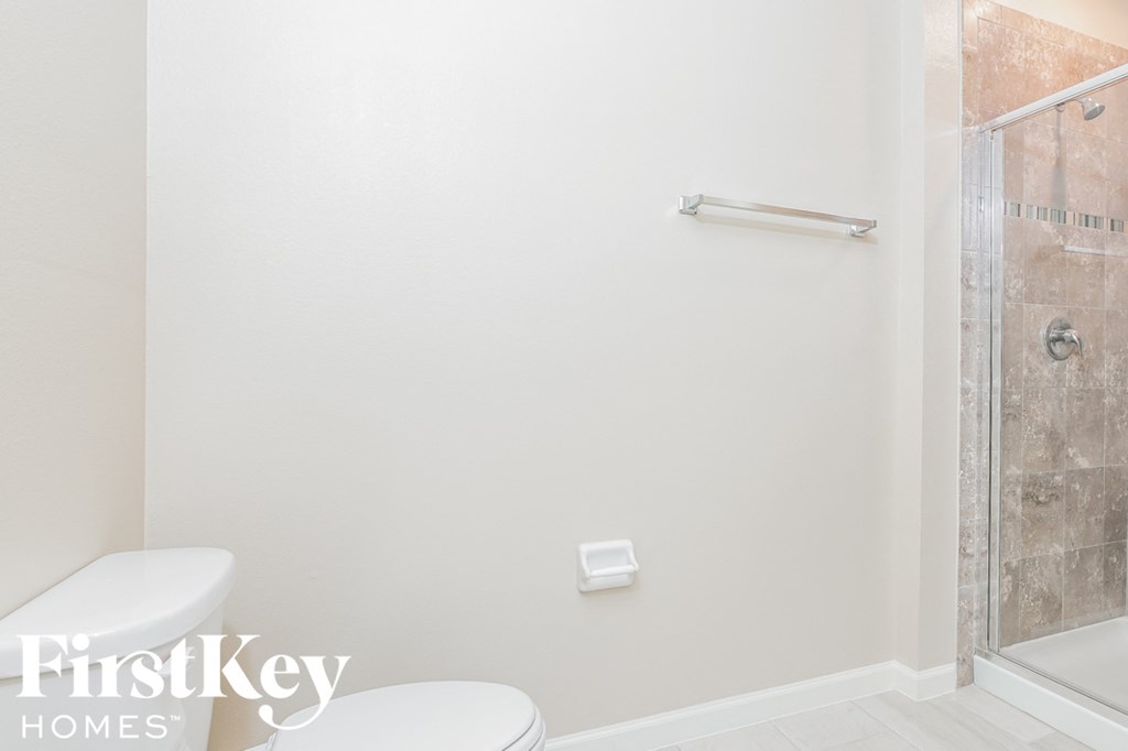 a small bathroom with a toilet and a shower