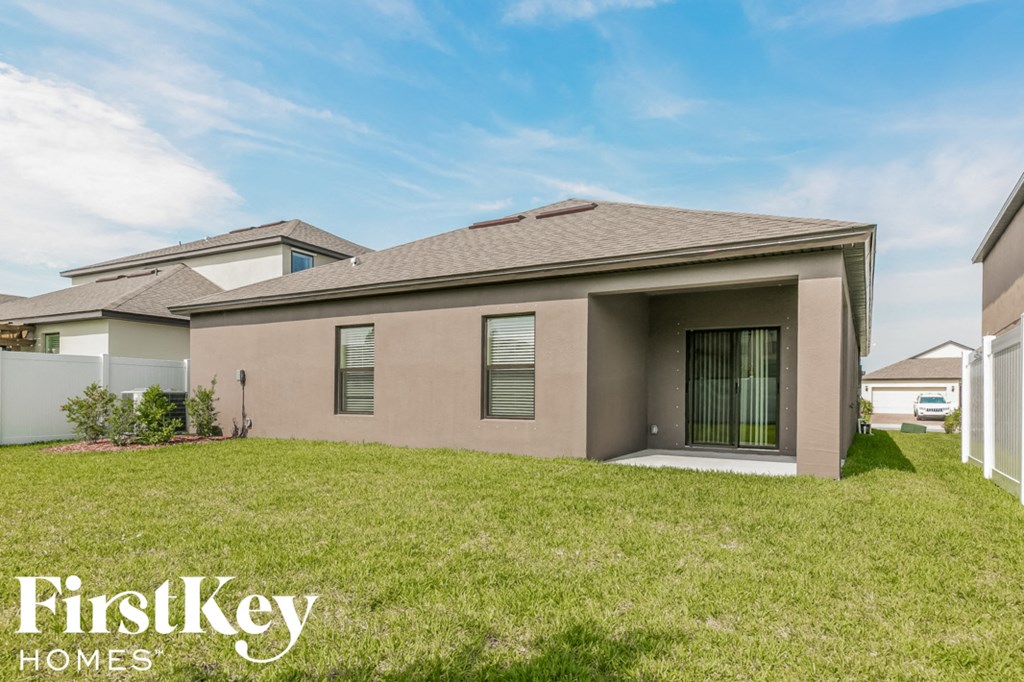 a house with a grassy yard in front of it