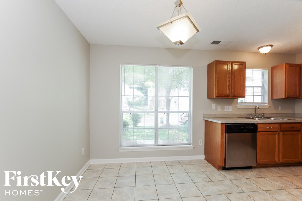 a kitchen with a sink and a window