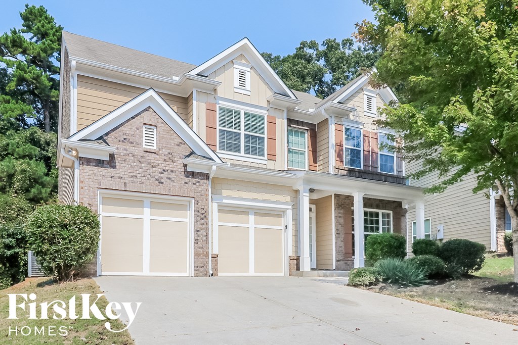 A large house with a driveway in front of it.