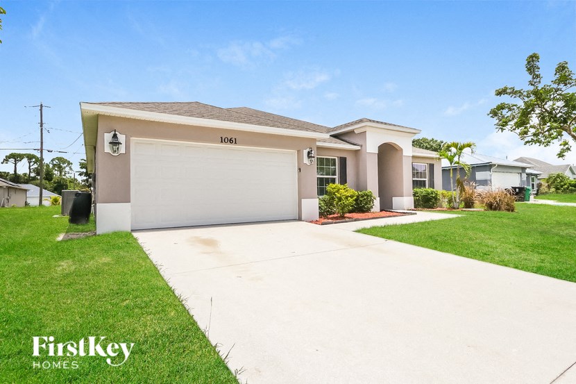a house with a driveway and a garage door
