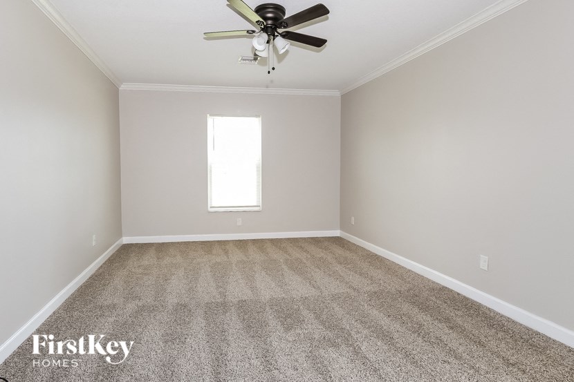 a empty room with a ceiling fan