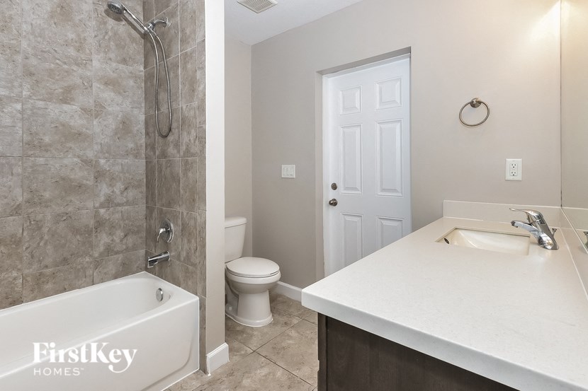 a bathroom with a sink toilet and a shower
