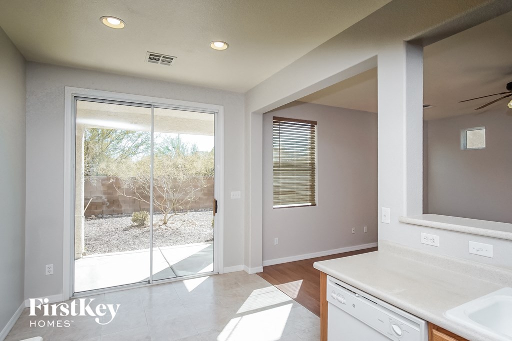 a bathroom with a window and a sink and a mirror