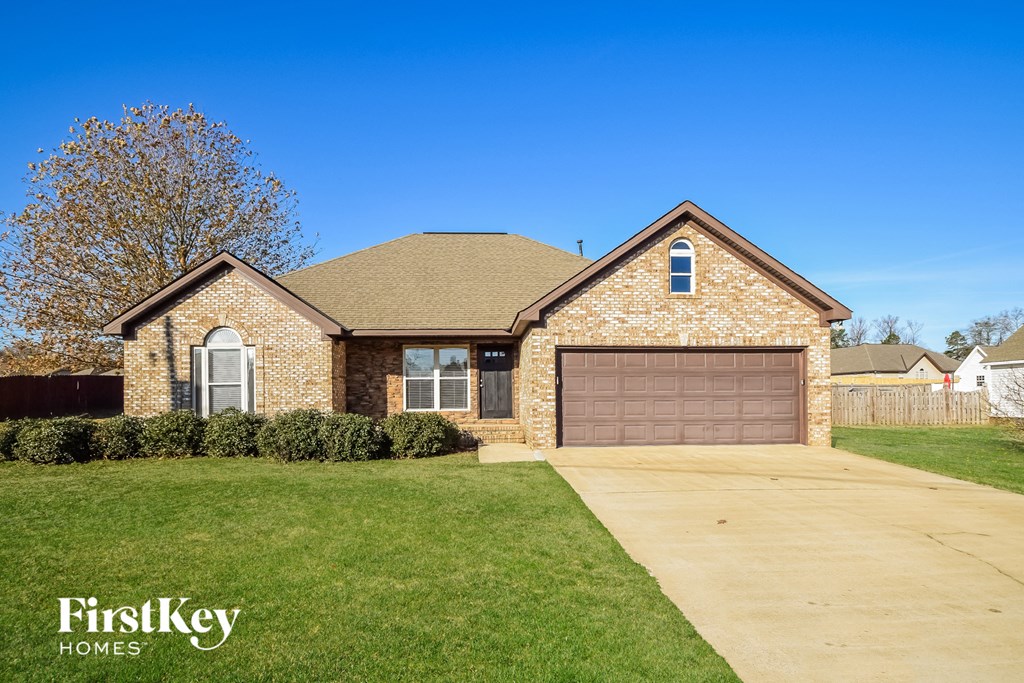 A house with a garage is for sale by FirstKey Homes.
