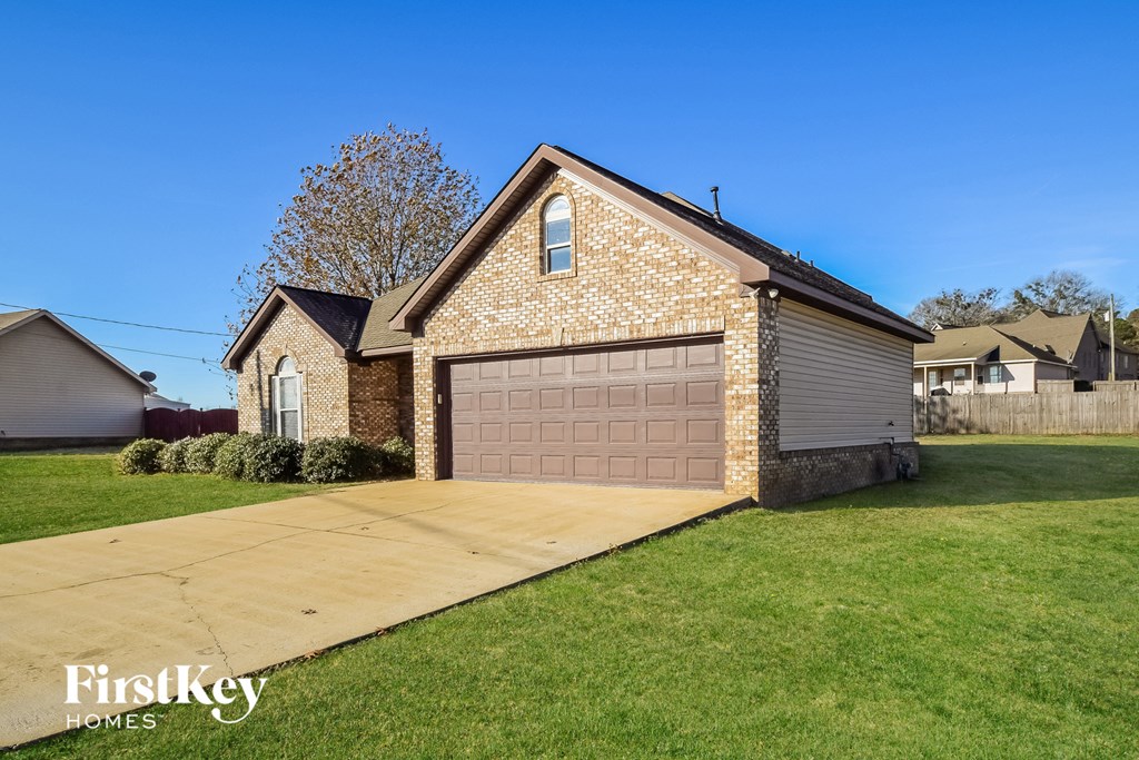 A house with a garage is for sale by FirstKey Homes.