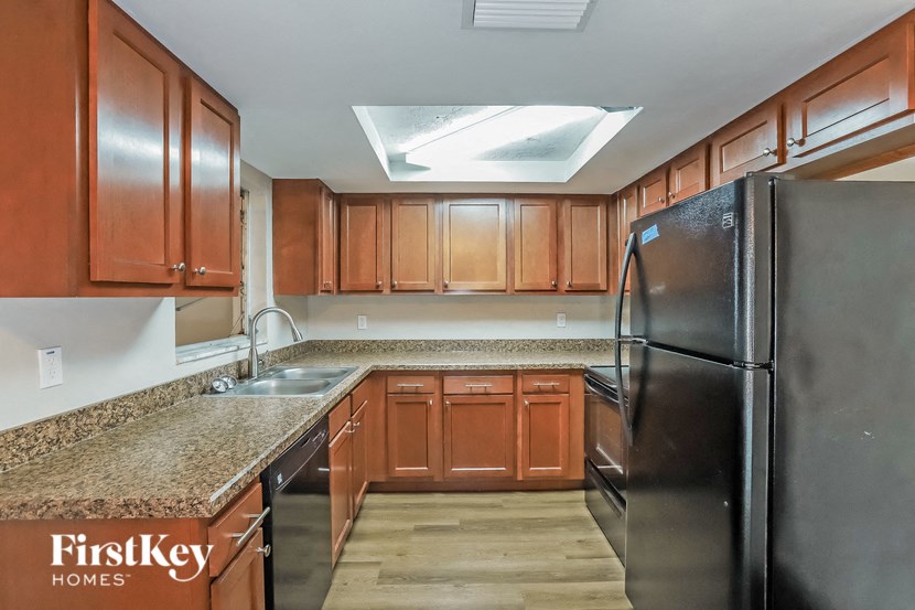 a kitchen with stainless steel appliances and granite counter tops