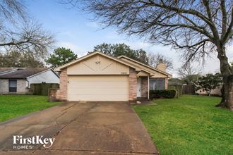 a house with a white garage door on a driveway