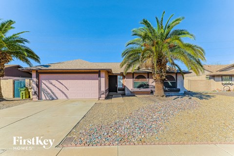 a house with a palm tree in front of it
