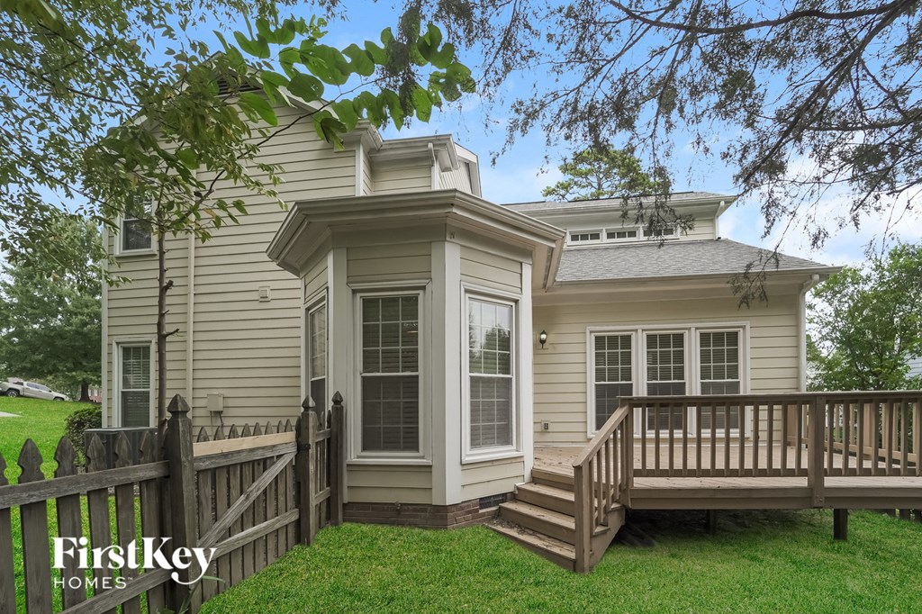 the exterior of a home with a porch and a deck