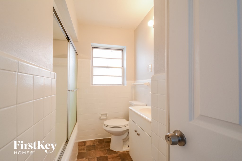 a small bathroom with a toilet and a shower