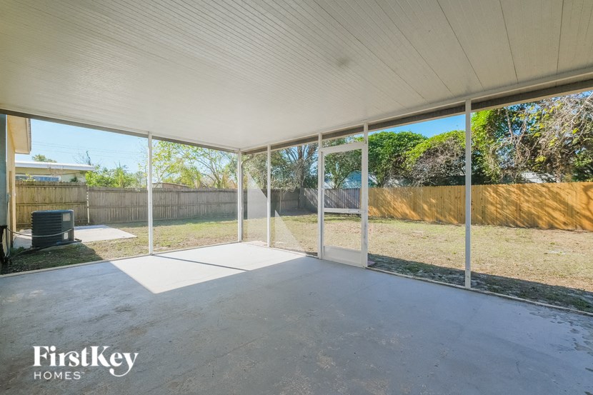 A large, empty patio area with a FirstKey Homes logo.