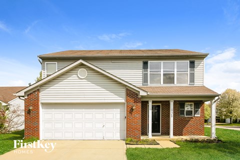 a white house with a white garage door