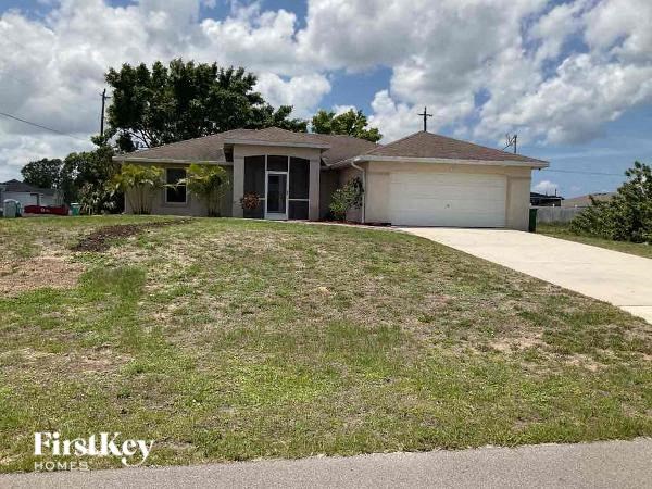 a house with a grassy yard in front of it