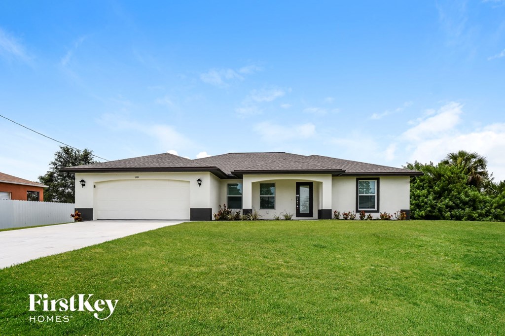 a house with a lawn in front of it