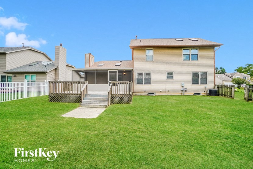 A house with a lawn in front of it.