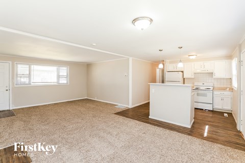 a kitchen with white cabinets and a white counter top