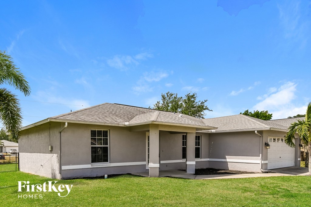 A house with a garage is for sale by FirstKey Homes.