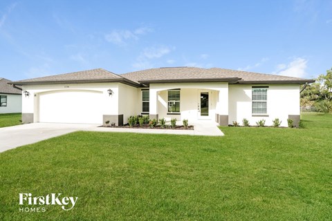 a house with a lawn in front of it