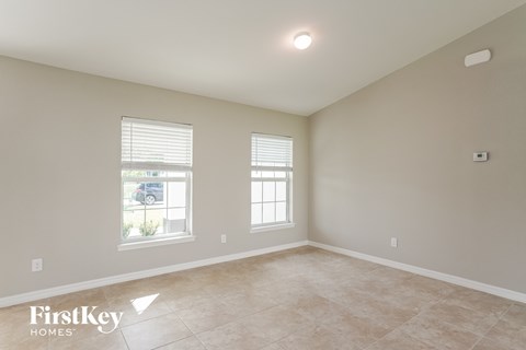 the spacious living room is clean and ready for the family to use