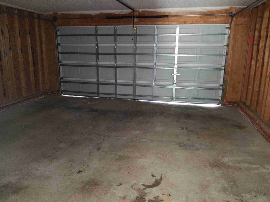 a garage with a plastic garage door in it