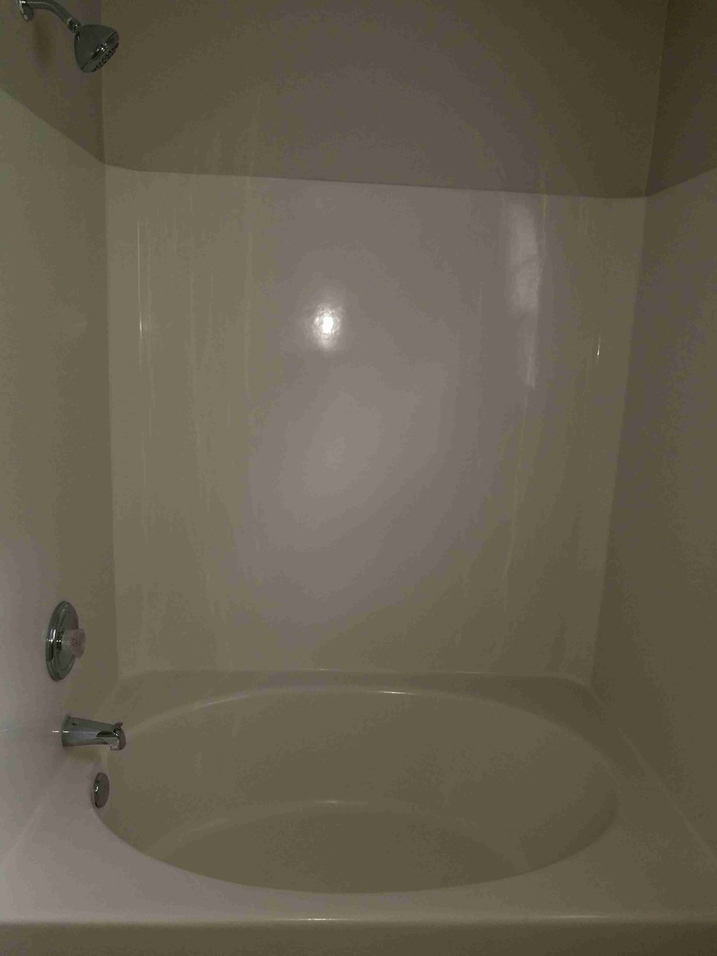 a bathroom with a bath tub and a faucet