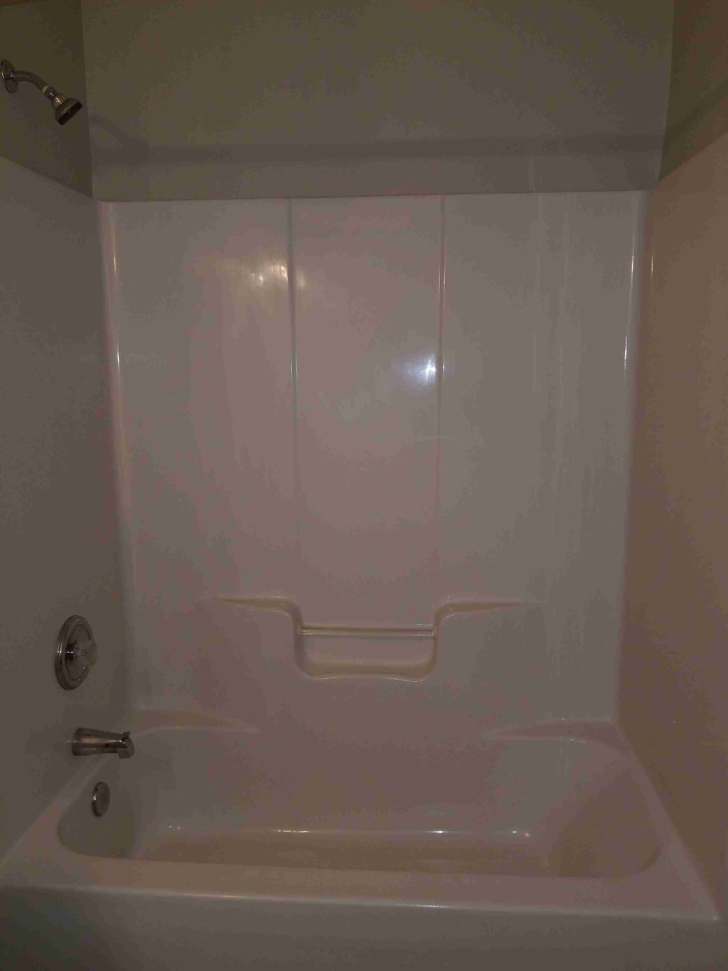 a bathroom with a shower and a bath tub