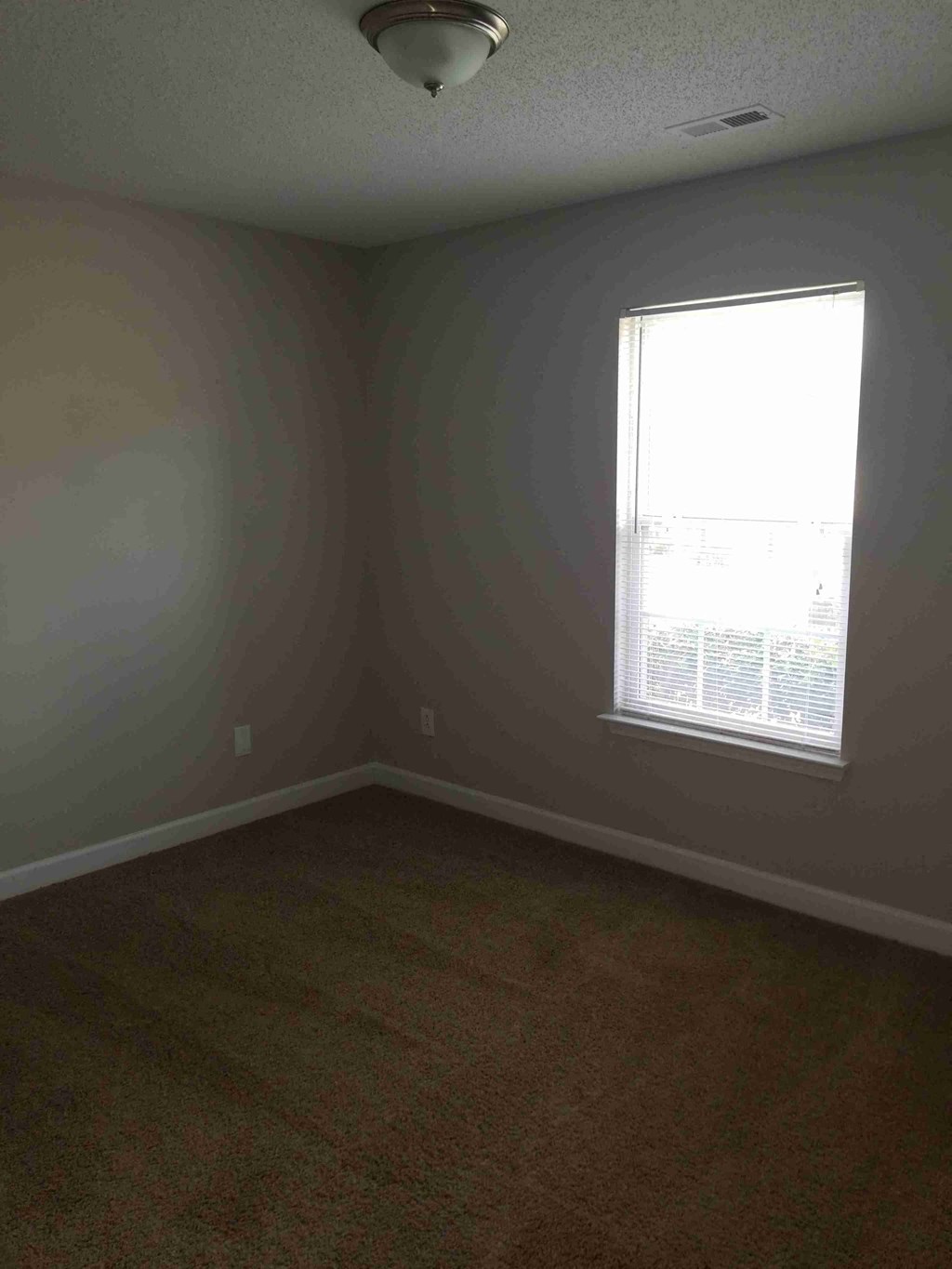 an empty room with a window in it