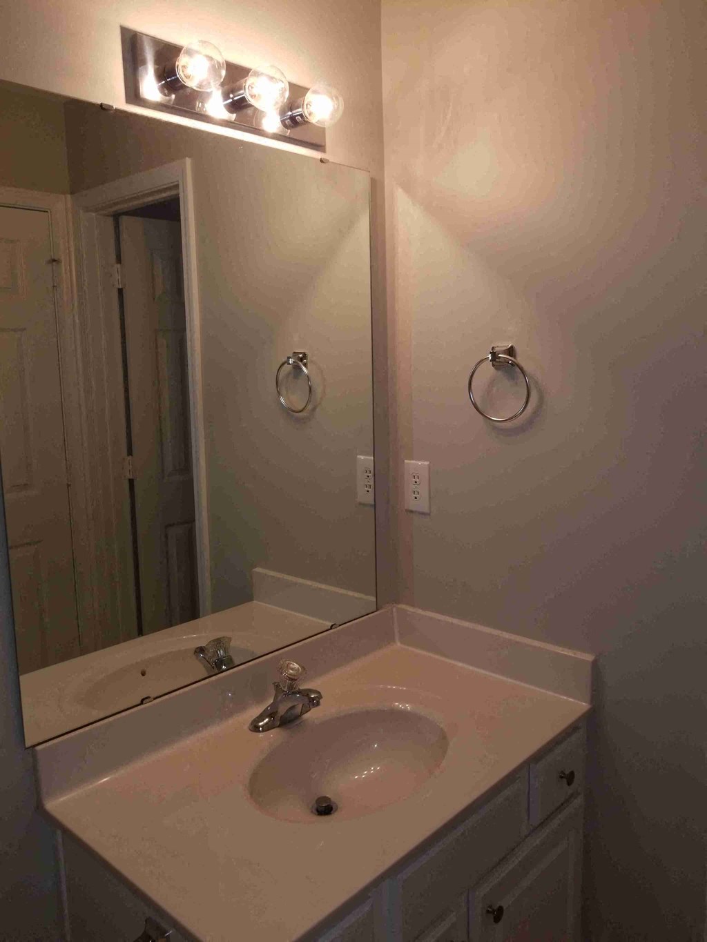 a small bathroom with a sink and a mirror