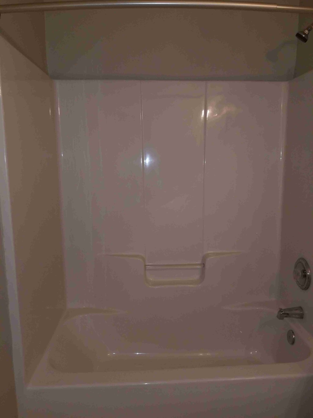 a bathroom with a shower and a bath tub