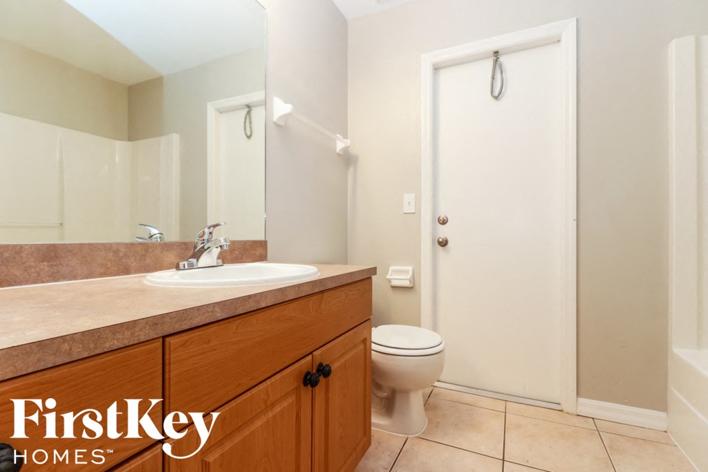 a bathroom with a sink toilet and a shower