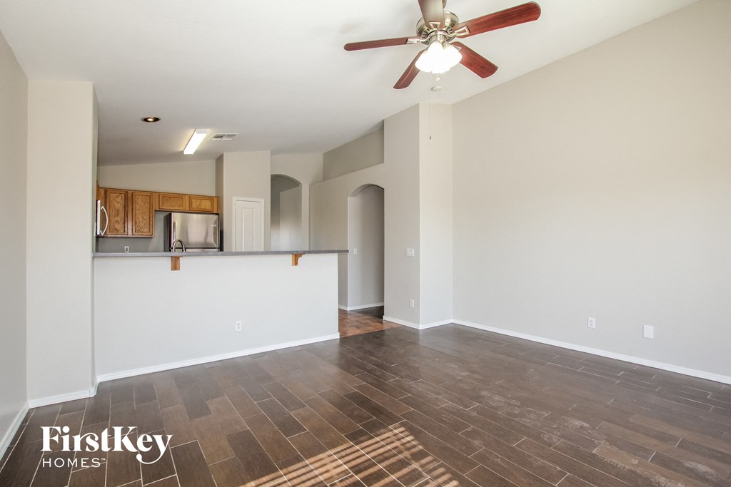 the living room is open to the kitchen and dining area
