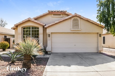 a house with a white garage door and a driveway