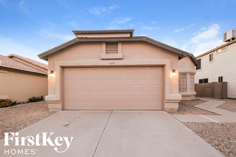 a single story home with a garage door