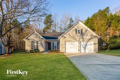 a house with a driveway and a garage door