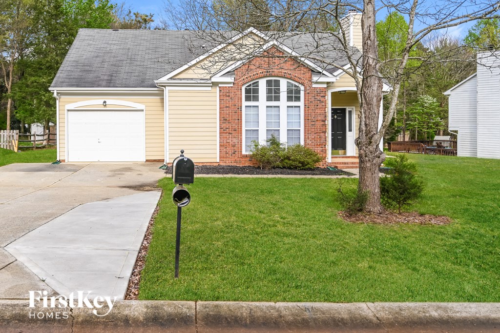 a house with a parking meter in front of it