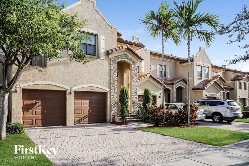 A house with a brown garage door is for sale.