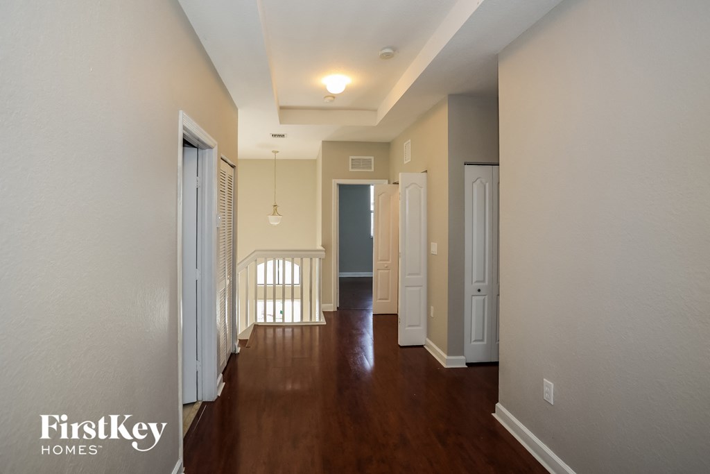 A long hallway with a FirstKey Homes logo.