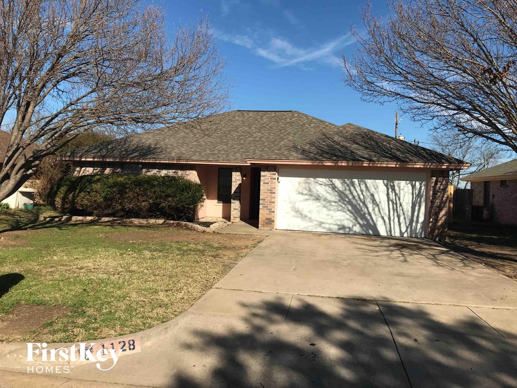 a house with a driveway and a garage door
