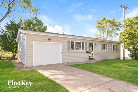 A two-car garage with a FirstKey Homes logo.