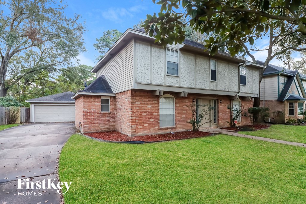 a brick and with a yard and a sidewalk