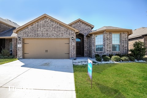 a house with a driveway and a garage door
