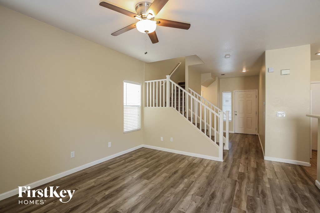 the spacious living room with stairs to the loft