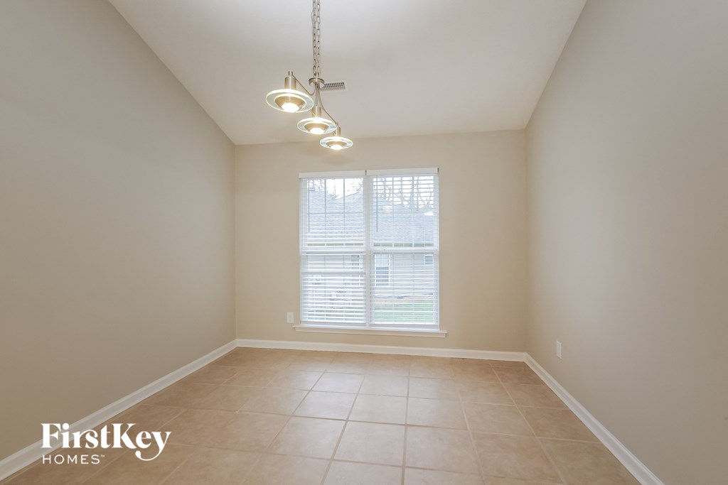 A room with a FirstKey Homes logo on the bottom left.