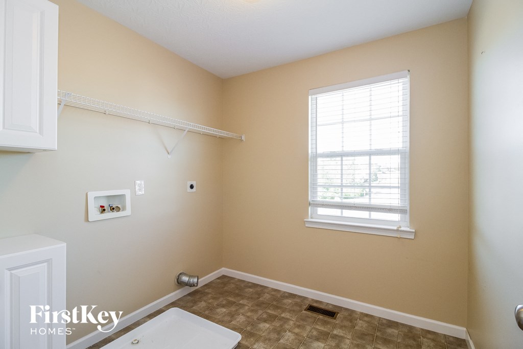 a bathroom with a sink and a window