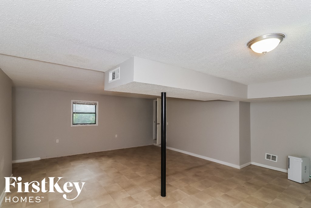 the living room of this home has been cleaned and updated