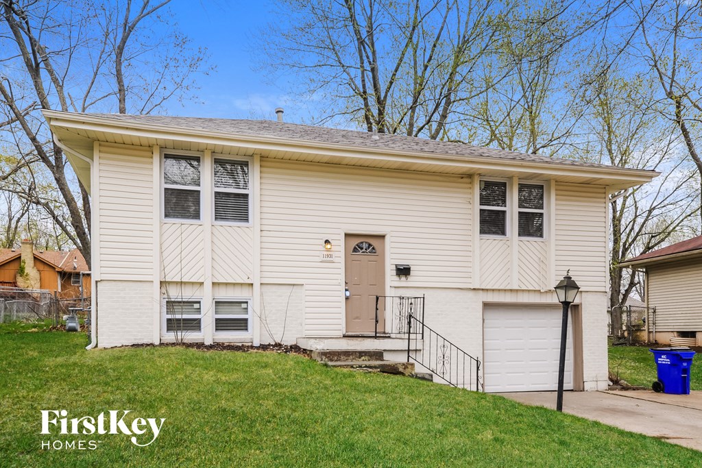 A two-story house with a garage is for sale.