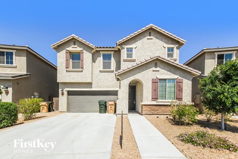 A large house with a driveway in front of it.